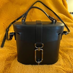 Botkier black crossbody bag, leather, clasp closure, adjustable strap. Like new.